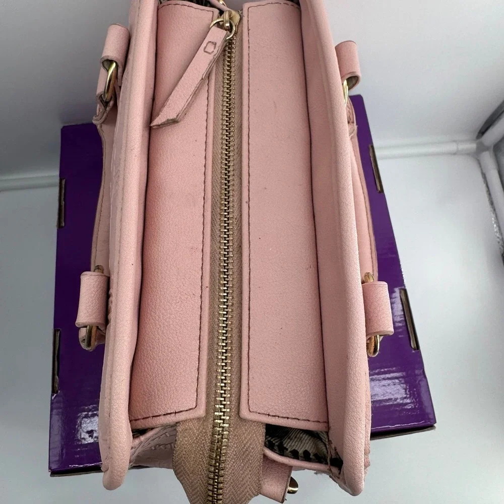 Y2K Juicy Couture satchel in pink, features an all-over embossed 